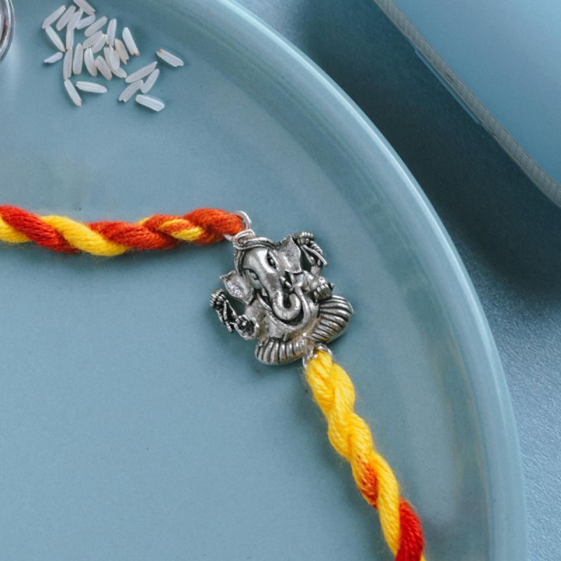 Threads of Blessings Ganesh Silver Rakhi